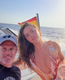 Mia Carragher and a man on a boat.