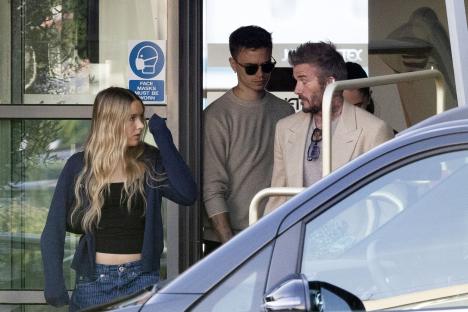 The Beckham family arriving at an airport.