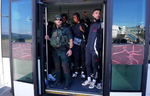 BILBAO, SPAIN - MAY 20: Leny Yoro of Manchester United (R) stands with teammates in the shuttle bus after arriving ahead of the UEFA Europa League Final 2025 between Tottenham Hotspur and Manchester United at Bilbao Airport on May 20, 2025 in Bilbao, Spain. (Photo by Juanma - UEFA/UEFA via Getty Images)