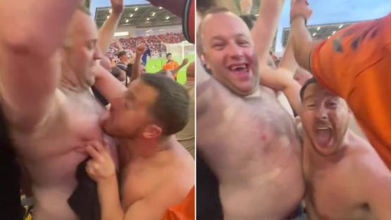 ‘Absolutely crying’ say fans as topless Oldham fan celebrates play-offs semi win by repeatedly licking mate’s nipple