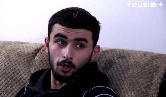 Young man speaking.