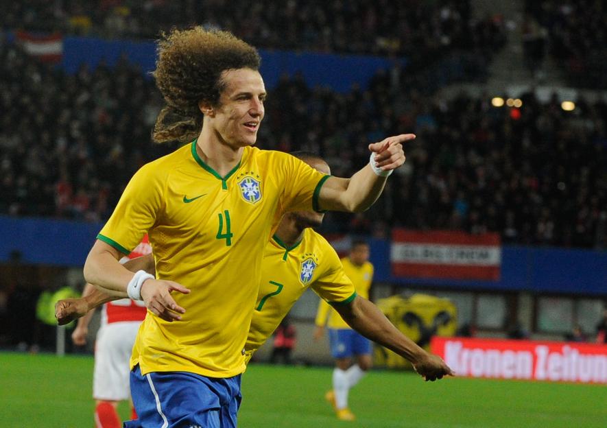 Brazil's defender David Luiz celebrating a goal during a football match.