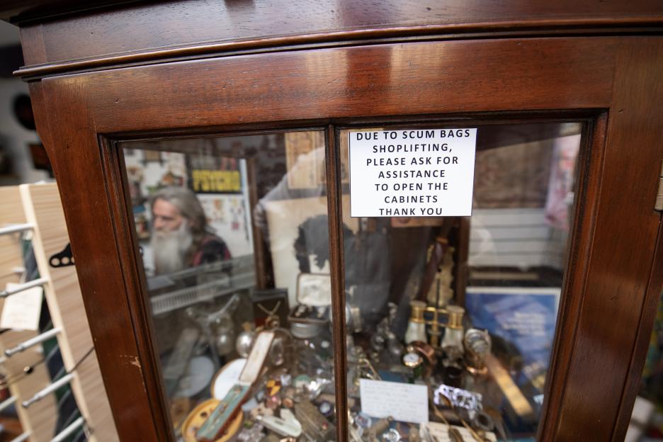 Shop owner's sign about shoplifting.