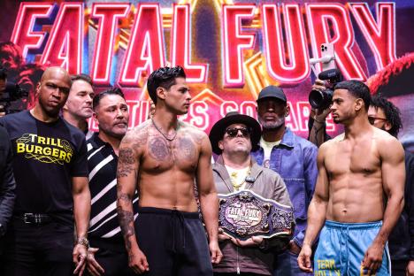 Ryan Garcia and Rolando Romero facing off at a weigh-in.