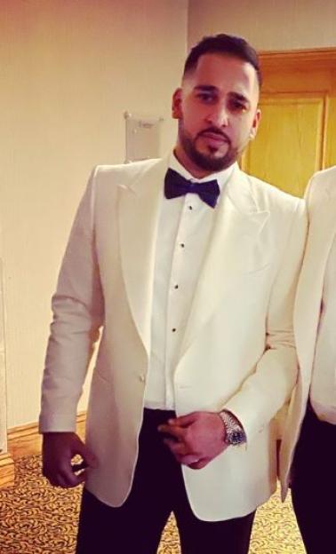 Salman Iftikhar in a white tuxedo.