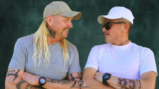 Joe Exotic and another man in profile view.