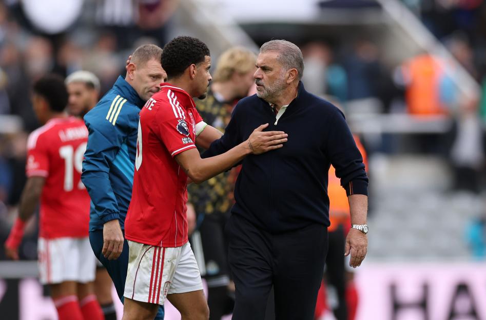 Morgan Gibbs-White of Nottingham Forest embraces Ange Postecoglou, Manager of Nottingham Forest.