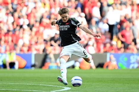 Martin Odegaard of Arsenal shoots the ball during a Premier League match.