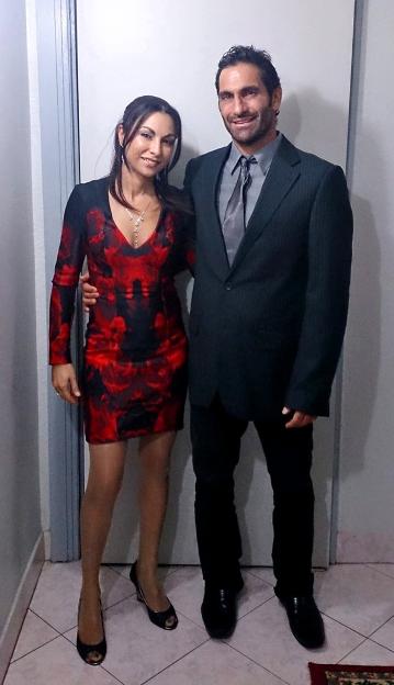 Photo of a couple dressed in formal wear.