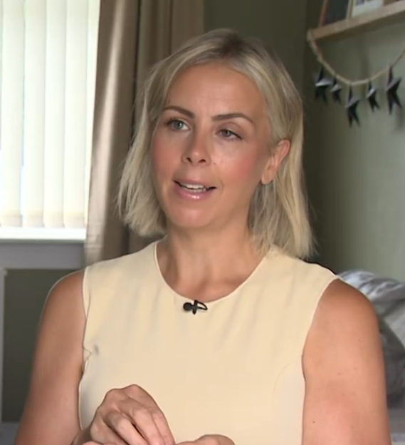 Woman with blonde hair speaking.