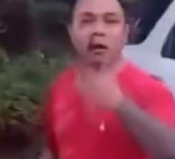 Man in red shirt speaking.