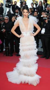 Kendall Jenner at the Cannes Film Festival wearing a sheer white gown.