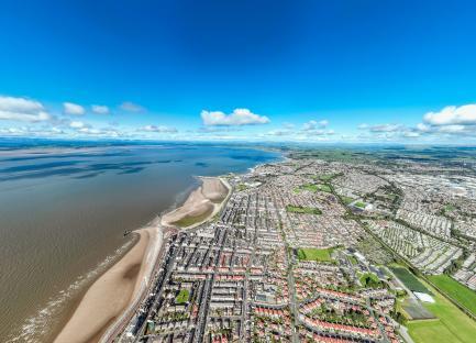 Aerial view of Morecambe seafront and town in Lancashire, UK.