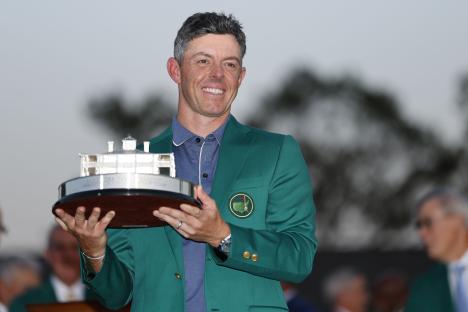 Rory McIlroy holding the Masters Tournament trophy.