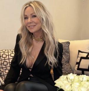 Roxanne Peterson in a black blazer and gold necklace.