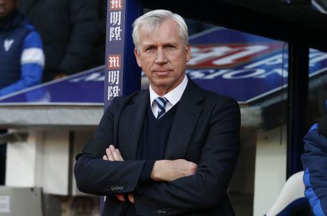 Alan Pardew, Crystal Palace manager, arms crossed.