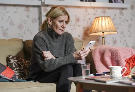 Woman looking at a smartphone.