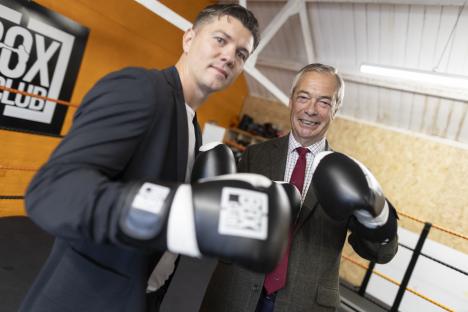 Nigel Farage and Luke Campbell wearing boxing gloves.