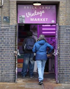 Two people entering Brick Lane Vintage Market.