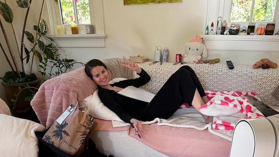 Selena Gomez poses as she signs autographs in living room but fans are distracted by ‘raunchy’ item in the background
