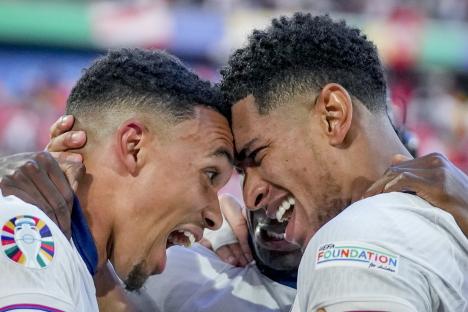 Jude Bellingham and Trent Alexander-Arnold celebrating after an England Euro 2024 quarterfinal match.