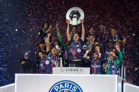 Paris Saint-Germain soccer team celebrating Ligue 1 victory.