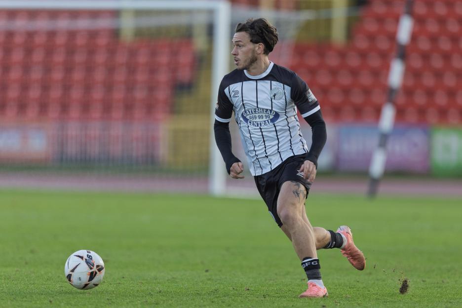 Soccer player Luke Hannant of Gateshead running on the field.