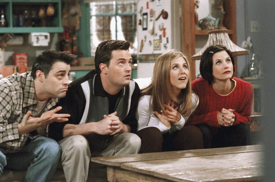 Friends cast reacting in a scene.