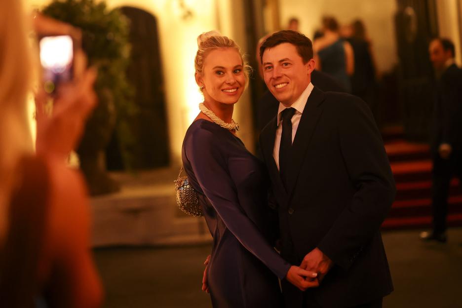 Matt Fitzpatrick and wife Katherine Fitzpatrick smiling and holding hands at the Ryder Cup Teams' Welcome Dinner.