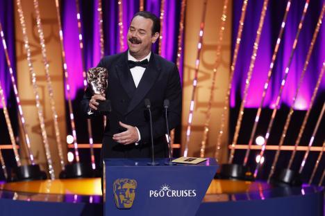 Danny Dyer accepting a BAFTA award.