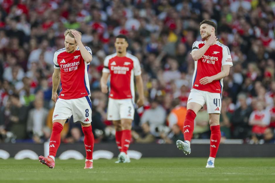 Odegaard and Rice of Arsenal looking dejected on the field.