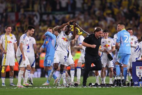 Leeds United players celebrating promotion to the Premier League.
