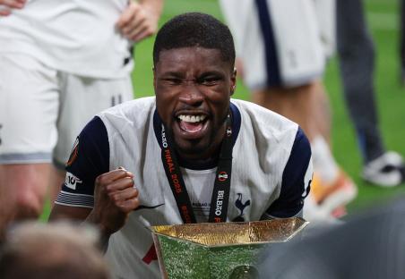 Kevin Danso of Tottenham Hotspur celebrates with the Europa League trophy.