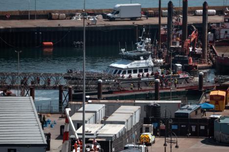Migrants disembarking from a Border Force vessel in Dover, England.