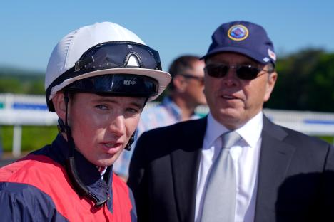 Jockey Colin Keane and trainer Ger Lyons at a horse race.