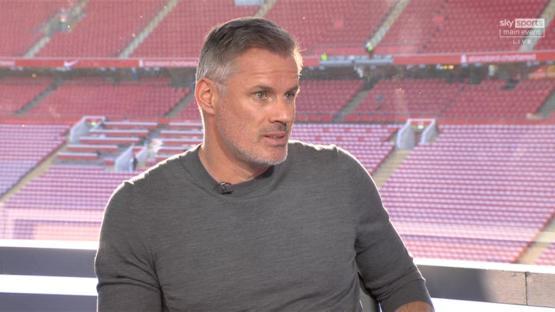 Jamie Carragher giving a pundit analysis during a Liverpool vs Arsenal match.