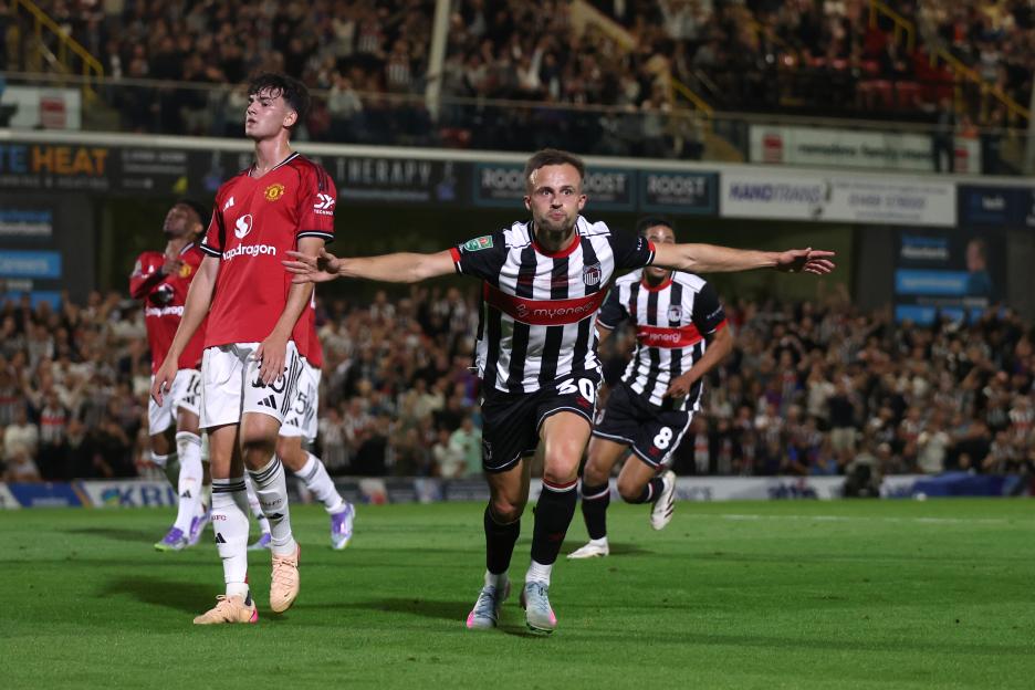 Soccer player celebrating a goal.