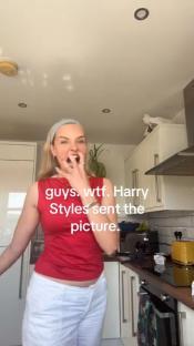 Woman reacting with shock in her kitchen; text overlay says Harry Styles sent her a picture.