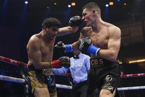 Gilberto Ramirez punches Chris Billam-Smith in a boxing match.