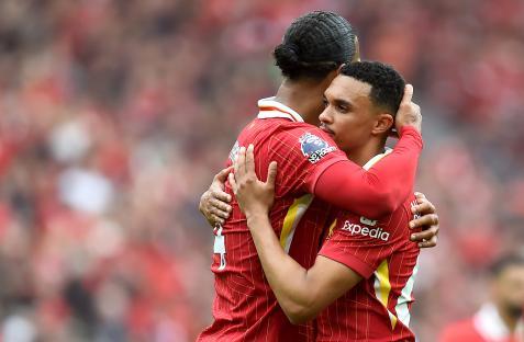Virgil van Dijk hugging Trent Alexander-Arnold.