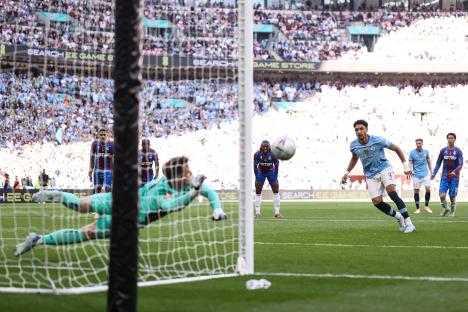 Dean Henderson of Crystal Palace diving to save a penalty kick.