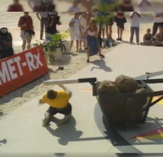 Strongman failing to lift heavy rocks.