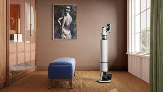 Illustration of a Samsung Bespoke AI Jet Ultra cordless stick vacuum cleaner in a room.