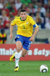 Brazilian soccer player running on the field.