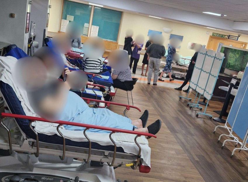Patients in hospital beds in a closed café.