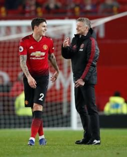 Manchester United's Victor Lindelof and Ole Gunnar Solskjaer on the field.