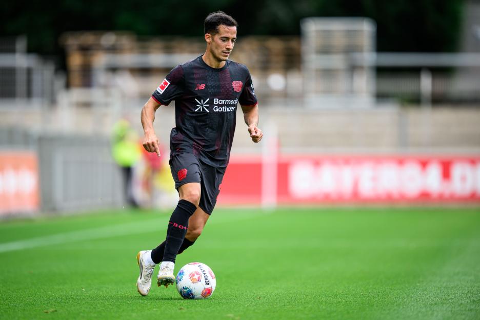 Lucas Vazquez of Leverkusen controlling the ball during a soccer match.