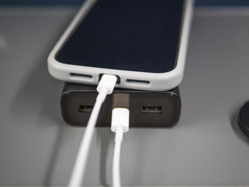 Phone charging with a power bank.