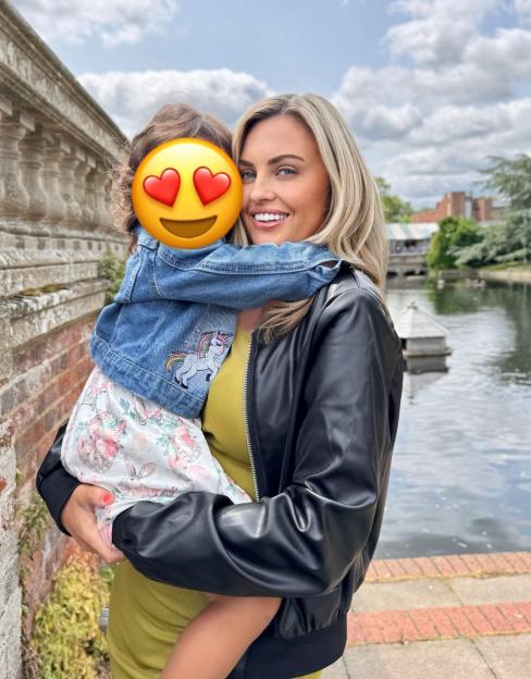 Carla Bellucci holding her daughter.