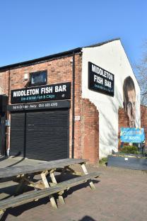 Mural of a former Manchester United and England player on a fish bar in his hometown.